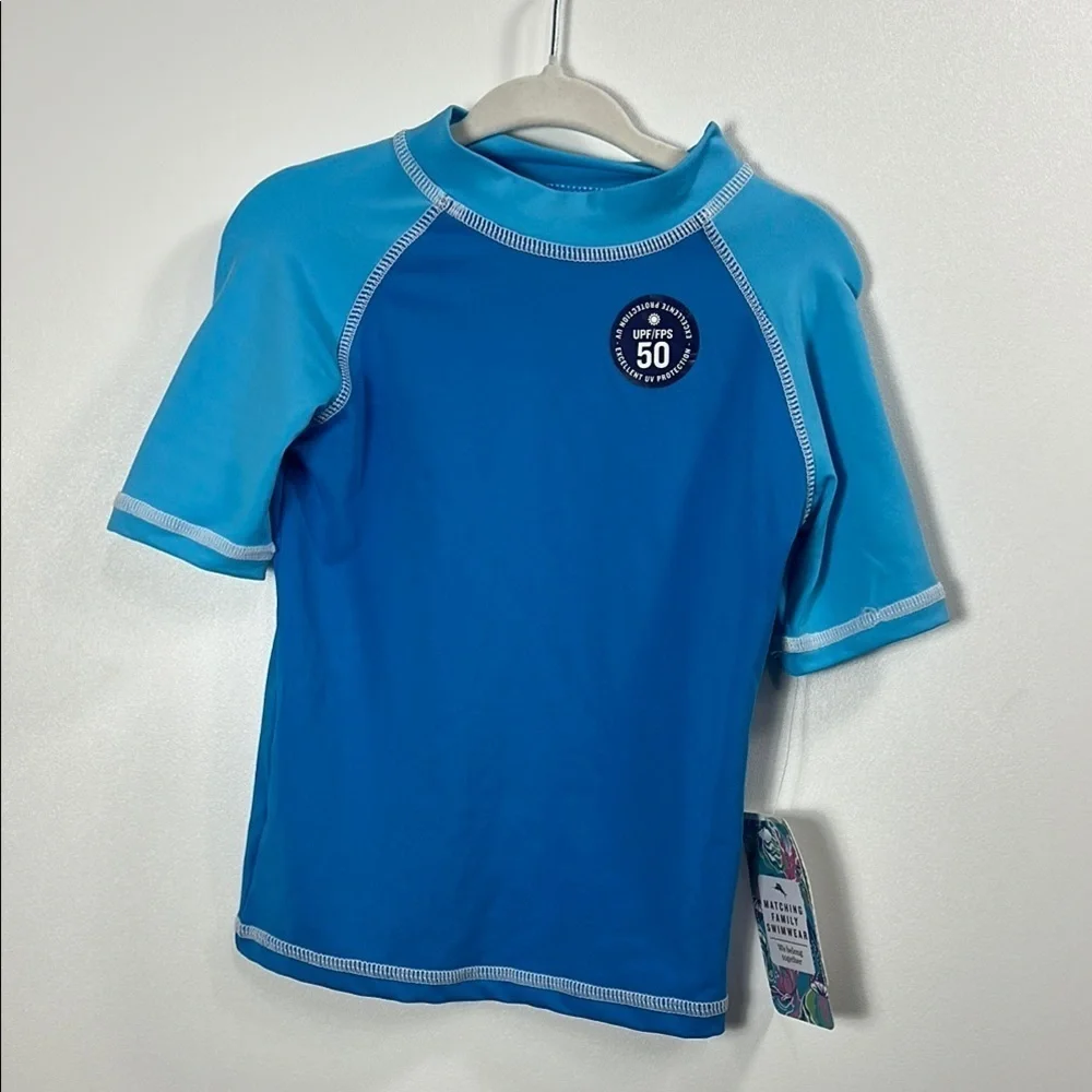 Tommy Bahama boys blue swim shirt size 3T. NWT.